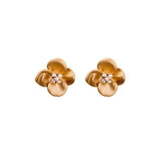 Elegant gold flower stud earrings with sparkling zircon centers on a white background