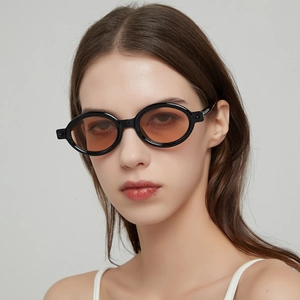 Retro thick oval frame sunglasses for men and women with orange lenses in a high fashion style