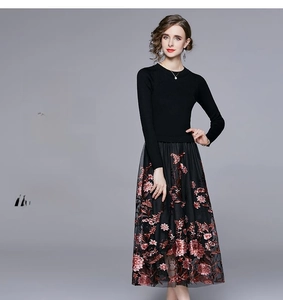 Close-up of vintage floral embroidery on double-layered mesh skirt with red and pink roses