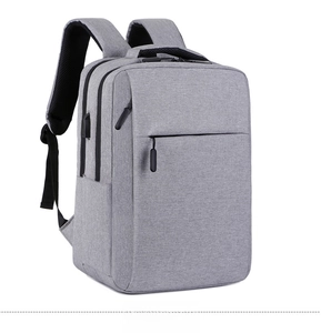 Detail of light grey business backpack side with integrated USB charging port