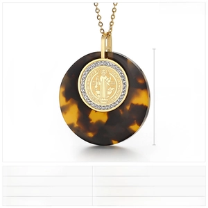 Detailed macro view of vintage religious pendant with St. Benedict medal and 43mm diameter