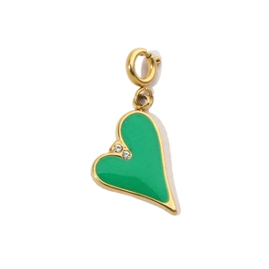 Detail of green enamel heart pendant with gold edging and sparkling crystals