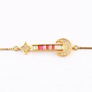 Gold plated star and moon bracelet with colorful zircon stones on white background