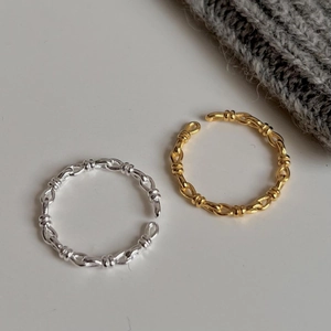 Minimalist twisted knot open rings in gold and silver finish with woven chain texture