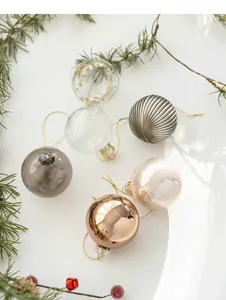 Set of six 6cm Christmas glass balls with mixed textures on pine branch background