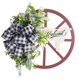 Rustic wood wheel wreath with a white cow Welcome sign and black-white plaid bow