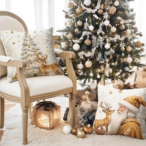 Linen Christmas pillow cover with reindeer and Santa motifs near a festive tree