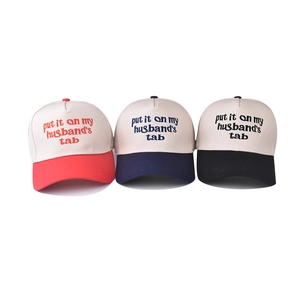 Three cotton baseball caps in red, navy, and black with embroidered contrast design