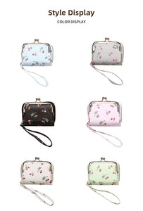 Detail showing various colors of cherry pattern card holders with wrist straps