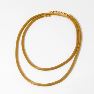 Elegant gold double-layer mesh chain necklace with woven metallic texture on white background