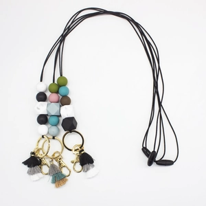 Detailed top view of colorful silicone bead lanyards with metal hooks and tassels