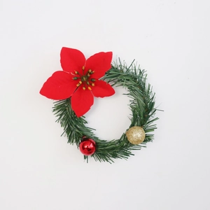 Christmas wreath with red poinsettia, green pine needles, red ball and gold glitter bauble