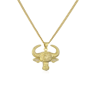 Detailed view of 18K gold plated bull head pendant with zircon accents on Cuban chain