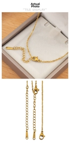 Detail of gold stainless steel necklace chain with lobster clasp and S-STEEL tag