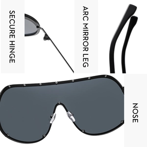 Detailed close-up of secure hinges and black oversized shield frame sunglasses