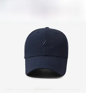 Detail of navy baseball cap featuring 3D embroidered Near & Dear logo with geometric pattern