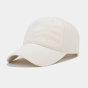 Close-up of smile embroidery on cream canvas cotton baseball cap with neat stitching