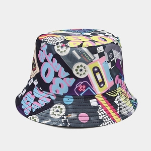 Detail of 80s retro graffiti print on black reversible bucket hat with tape patterns