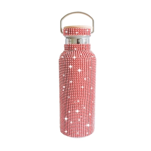 Sparkling red rhinestone-encrusted 17oz vacuum insulated tumbler with a metal handle