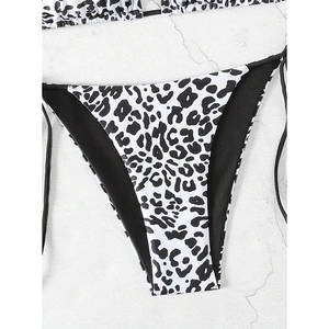 Detailed view of high-cut leopard print bikini bottoms with adjustable black side ties