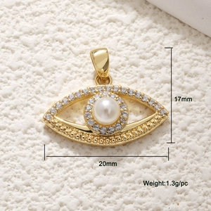 Detailed view of gold eye pendant with white pearl and zircons, size 17x20mm and 1.3g weight