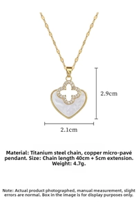 Macro shot of clover heart pendant featuring white mother of pearl and cubic zirconia details