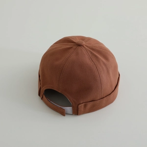 Detailed back view of brown cotton miki hat featuring adjustable velcro closure detail