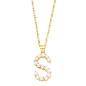Detail of gold letter S pendant adorned with white pearls on a minimalist link chain