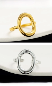 Detailed comparison of 18k gold and silver stainless steel oval open rings in glossy finish