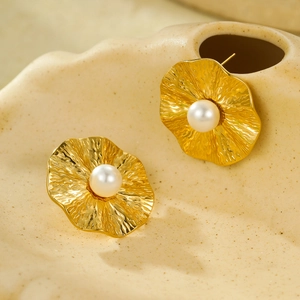 Gold irregular pleated petal stud earrings with central pearl on shell ceramic base