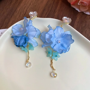 Detail of blue chiffon flower earrings with crystal heart stud and water drop bead