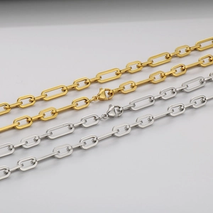 Detailed close-up of gold and silver square link chains with lobster clasps
