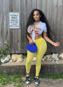 Blue textured pebble handbag paired with white hot rod crop top and yellow mesh pants