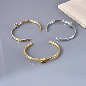 Three-color minimalist knot twist open bracelets in gold, silver and mixed tones