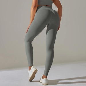 Close-up of seamless scrunch leggings in sage green showing body-shaping texture