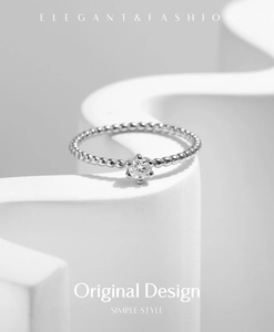 Close-up of S925 silver beaded ring featuring a sparkling round solitaire moissanite