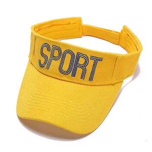 Close-up of yellow sports sun visor featuring blue SPORT embroidery and velcro strap