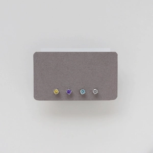 Set of four stainless steel studs with round-cut crystals in multiple vibrant colors
