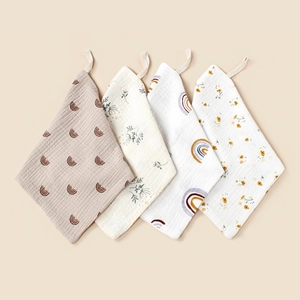Detail of 4-pack muslin baby washcloths with hanging loops and waffle texture cotton