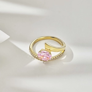 Macro detail of the S925 stamp on a gold-plated silver ring with a pink oval gemstone