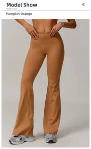 Detail of high waisted flared yoga leggings in pumpkin orange with matte texture