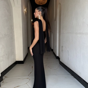 Elegant black backless bodycon maxi dress with light matching tulle shawl and ribbon detail