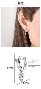 Bow earrings with blue heart pendant shown in ear and size chart dimensions