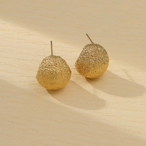 Golden titanium steel earrings with frosted irregular texture and spherical design