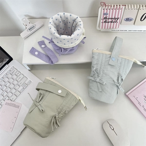 Detailed top view of large capacity macaron colored canvas pencil cases with cute bows