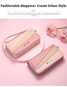 Detail of pink and beige two-tone double zipper long wallet with a wrist strap
