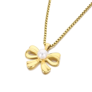 Elegant gold bow pendant necklace with white pearl on a classic box chain