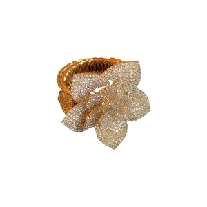 Adjustable gold flower ring with layered petals and white zircon pavé setting