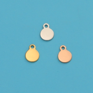Polished round stainless steel charms in silver, gold, and rose gold on a blue background