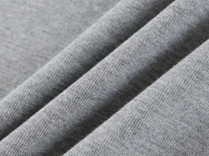 Macro detail of soft grey heather modal knit fabric showing smooth texture and high elasticity